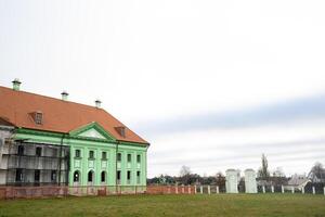 Ruzhansky Palace and the ruins of the facade of an abandoned ruined building of an ancient castle of the 18th century.Belarus photo