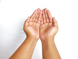 Religion. Man with open palms praying on white background, closeup photo