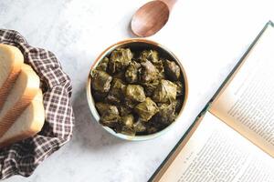 Stuffed Grape Leaves With Bread and Book photo