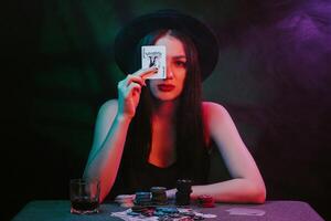 poker player at a casino table with cards and chips photo