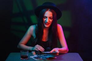 poker player at a casino table with cards and chips photo