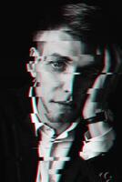 black and white portrait of a man with glitch effect photo