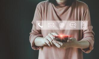 Hand Using Smartphone for Connect a Community, contact icons email, address, live chat, internet wifi. Metaverse, Technology Concepts. Contact us or Customer support hotline people connect. photo