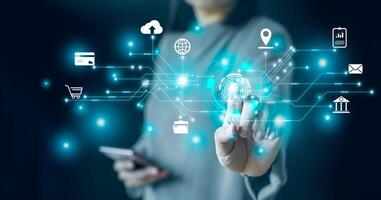 Hand pushing a button on a touch screen interface. Future technology. Interaction in technology futuristic within business industry, ICT Information communication internet concept.Global Virtual Icon photo