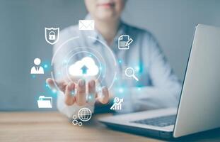 Woman use Laptop with cloud computing diagram show on hand. Cloud technology. Data storage. Networking and internet service concept. Download, upload, backup wireless conceptual. Virtual platform. photo