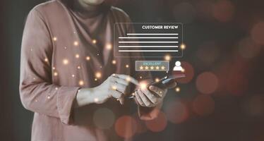 Woman customer review satisfaction excellent feedback survey concept. User give rating to service experience online application. Evaluate quality of service leading to reputation ranking of business. photo