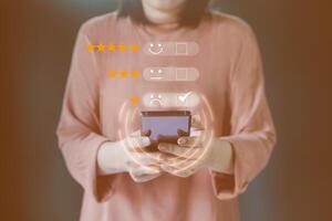 Customer satisfaction assessment and concept. Business man use mobile phone to provide online ratings and opinions, experience survey to evaluate the services from the application and give unsatisfied photo