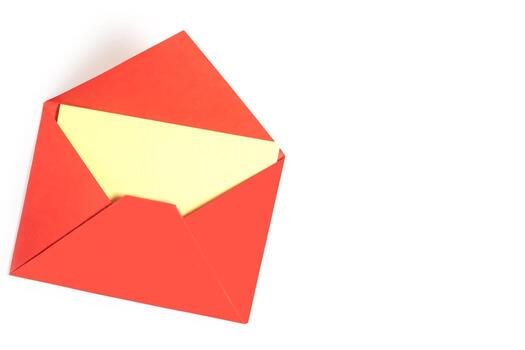 Red envelope with blank yellow paper isolated on white background with copy space. photo
