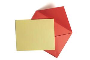 Plain yellow card on a vibrant red envelope for personal messages, invitations. Top view photo