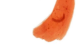 Abstract red watercolor brush strokes on white background. Top view photo