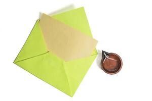 Happy Diwali celebration greeting card and clay diya lamp isolated on white background. photo