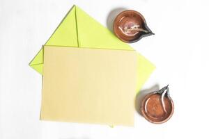 Happy Diwali celebration greeting card and clay diya lamp isolated on white background. photo