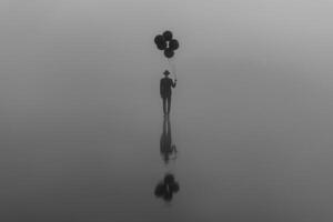 surreal creative portrait of a man in a suit with a hat with balloons in his hand on the water photo