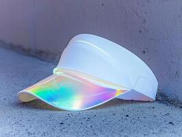 White visor with iridescent visor lying on the ground. photo