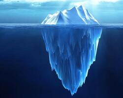A large iceberg floats in the ocean with only a small portion visible above the waterline. photo