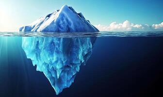 A large iceberg floats in the ocean, with most of its mass hidden beneath the surface. photo