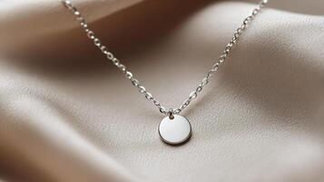 Minimalist Silver Necklace with Round Pendant on Beige Fabric photo
