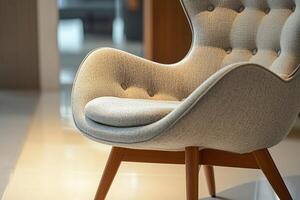 Chic modern chair with button tufts and angular wooden legs isolated photo