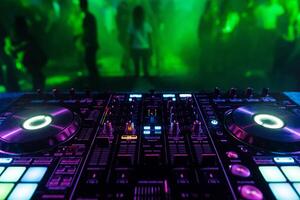 DJ mixer controller Board for professional mixing of electronic music in a nightclub photo
