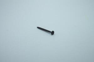 black iron wood screw isolated on white background photo