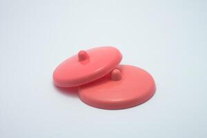 red plastic cup lid isolated on white background photo