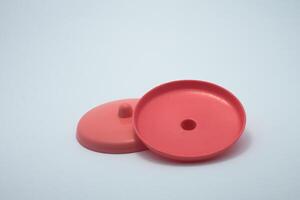 red plastic cup lid isolated on white background photo