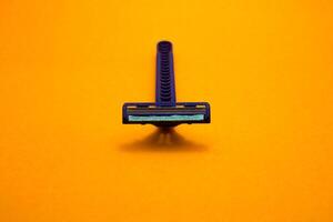 razor shaving mustache yellow background photo