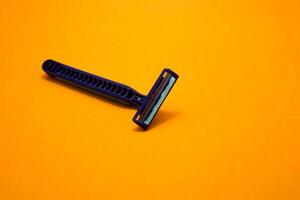 razor shaving mustache yellow background photo