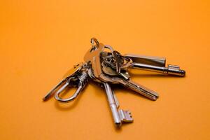 set of keys isolated yellow background photo