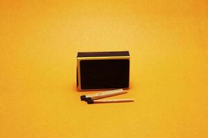 matches isolated on yellow background photo