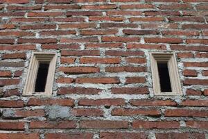 red brick wall texture background and ruster ventilation photo