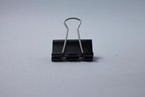 isolated black paper clip photo