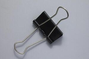 isolated black paper clip photo