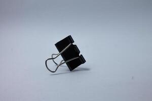 isolated black paper clip photo