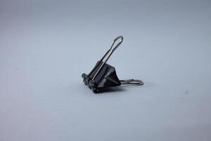isolated black paper clip photo