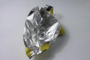 plastic foil waste from used snack wrappers photo