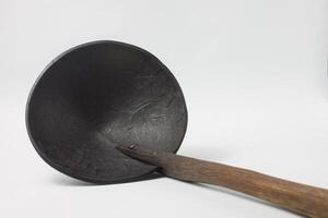irus, a ladle, a cooking utensil made from coconut shell and bamboo photo