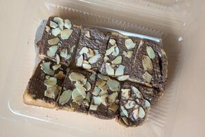 Slices of toast bread with chocolate cream and nuts photo