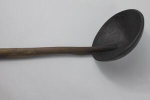 irus, a ladle, a cooking utensil made from coconut shell and bamboo photo
