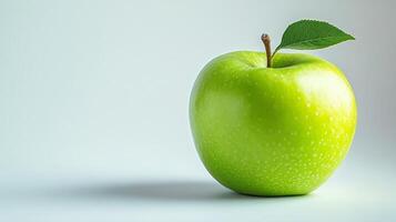Green Apple with Leaf on White Background photo