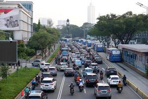 Jakarta traffic jam after on weekdays in the new normal of pandemic covid-19 in central of business office Sudirman street Jakarta, Indonesia - June 29, 2020 photo