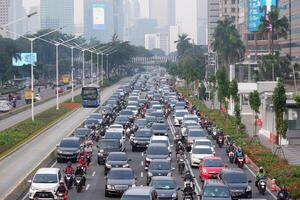 Traffic jam in the business center and offices main road of Jakarta on weekdays at busy hours in the pandemic Covid-19 Jakarta, Indonesia - July 29, 2020 photo