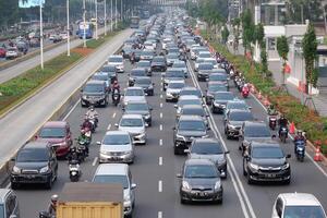 Traffic jam in the business center and offices main road of Jakarta at busy hours on weekdays after social restriction of pandemic Covid-19 Jakarta, Indonesia - July 29, 2020 photo