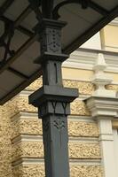 a close up of a metal post with decorative designs photo