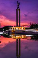 Beautiful Jakarta in colorful sunset. West Irian Liberation Monument in Lapangan Banteng formerly Waterloo Square, Jakarta. photo