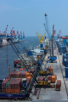 Container ship load import export and business logistic in commercial and business harbor, high angle view photo