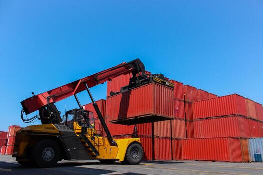 Loading and unloading shipping cargo with industrial crane. Export and import transportation. photo