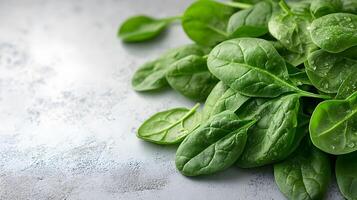 Fresh spinach leaves on a white background, ideal for promoting healthy eating, green vegetables, and nutritious plant-based diets. photo