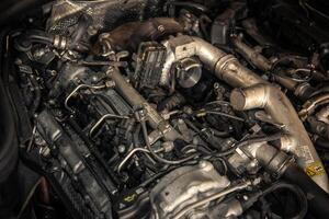 Modern vehicle diesel engine in a garage ready for service photo