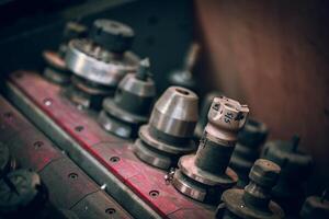 CMC machine spindle tools in a dusty toolbox in a metal workshop photo